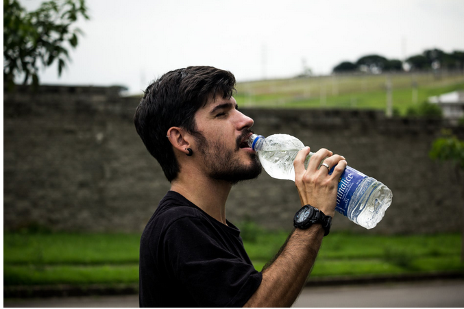 a man drinking water